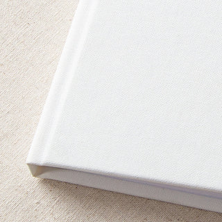 close up of plain white textured guest book